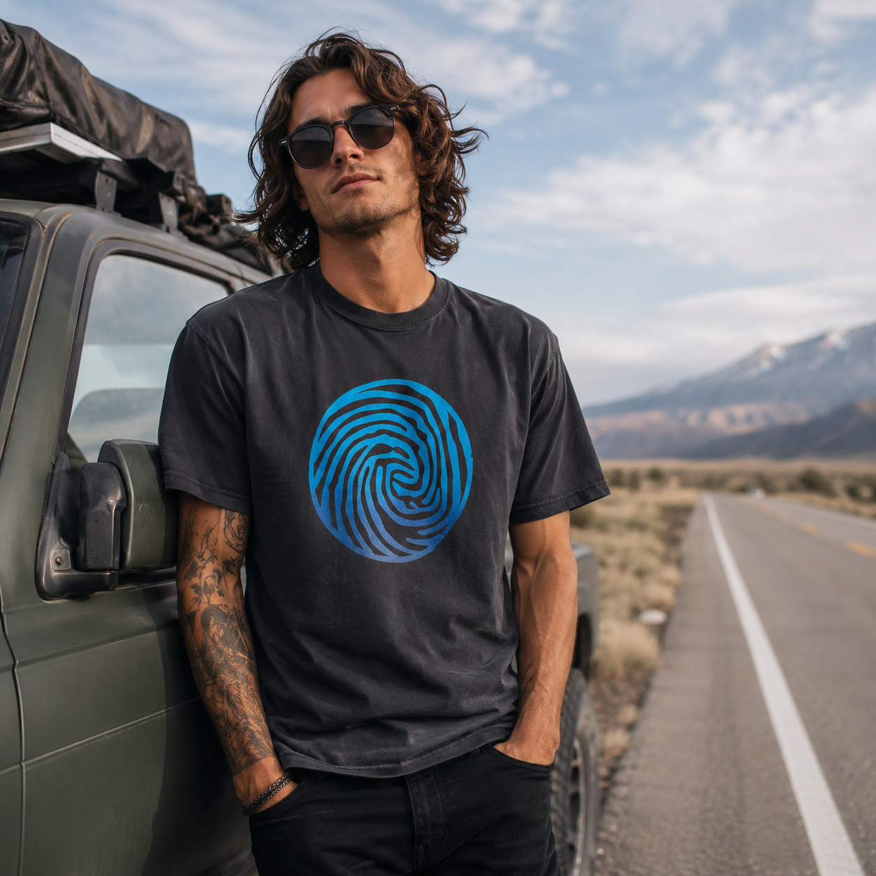 Man wearing t-shirt on the side of the highway